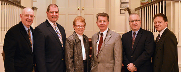 Senior business seminar speakers pose with Thiel College faculty and staff