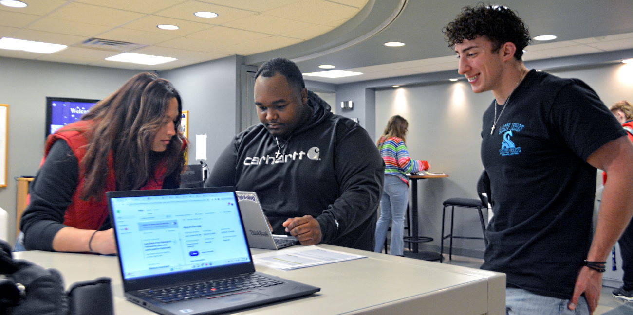 business admin sports management three students in group project