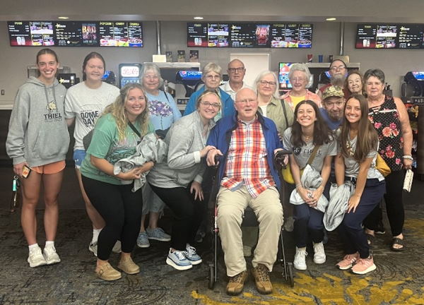 Caption: Graduate clinicians visit a local cinema to explore hearing assistive technology as an educational activity for the Harmony in Hearing aural rehabilitation group program.
