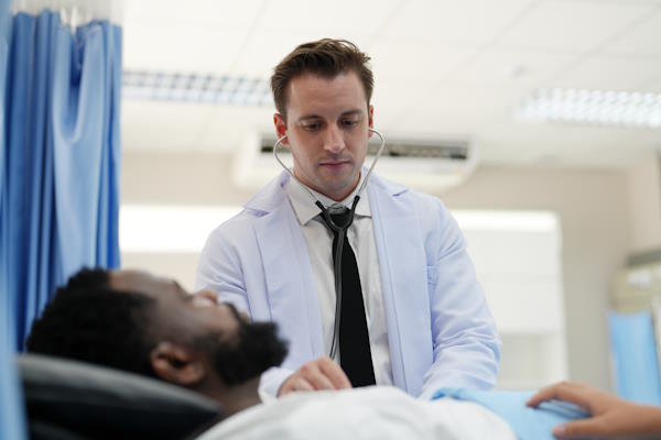 Doctor performing exam in the hospital
